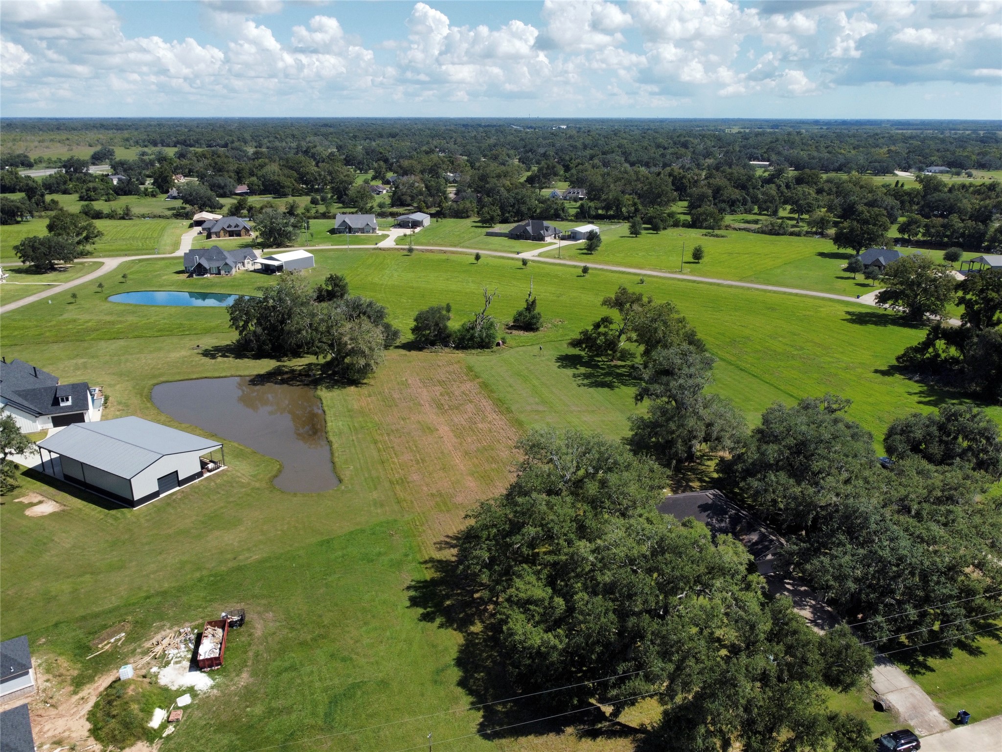 158 Cattle Drive Trail Angleton, TX 77515 - Photo 11 of 18 an aerial view of a houses with outdoor space and trees all around