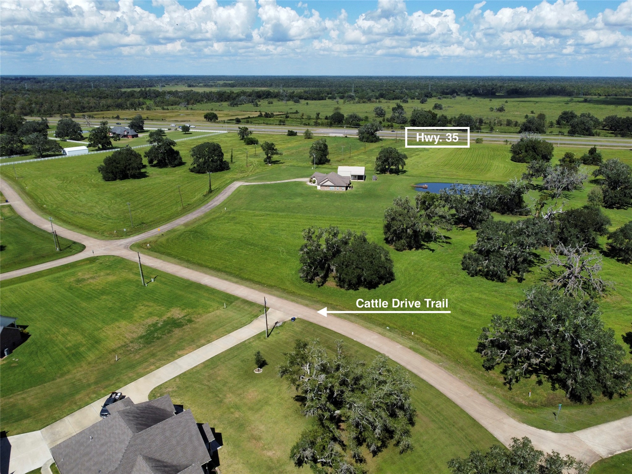 158 Cattle Drive Trail Angleton, TX 77515 - Photo 13 of 18 an aerial view of a golf course with a big yard