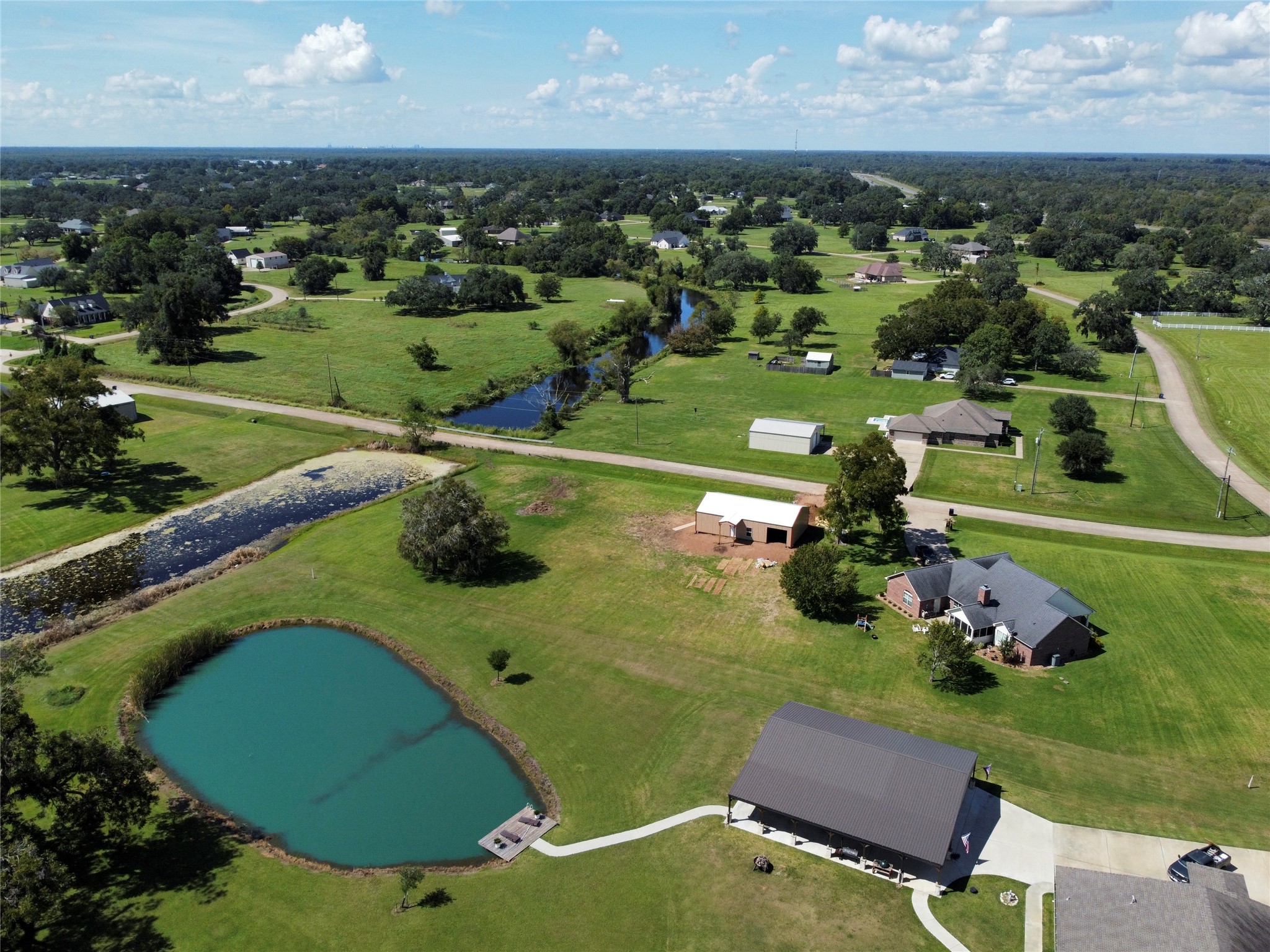 158 Cattle Drive Trail Angleton, TX 77515 - Photo 14 of 18 an aerial view of a house with yard swimming pool and outdoor seating