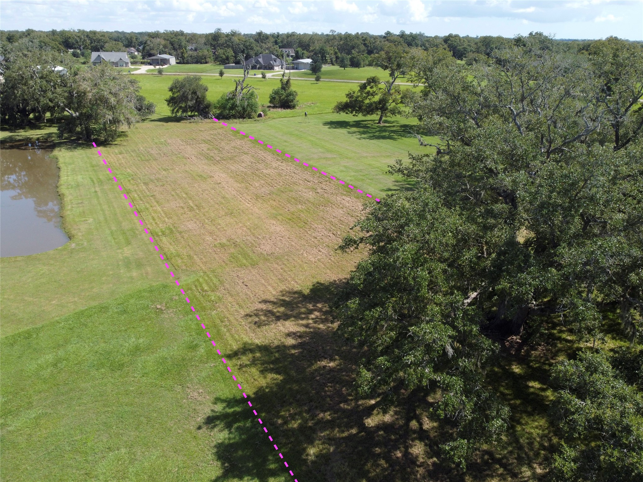 158 Cattle Drive Trail Angleton, TX 77515 - Photo 16 of 18 a view of a field with an ocean view