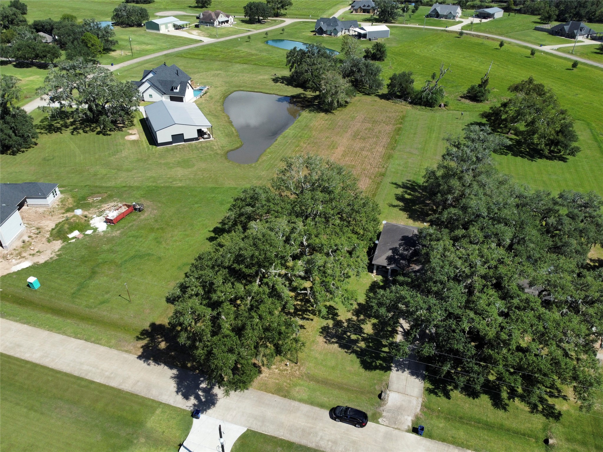 158 Cattle Drive Trail Angleton, TX 77515 - Photo 3 of 18 a bunch of trees sitting in the middle of garden