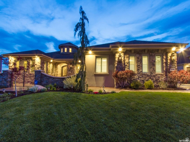 4378 Foothill Drive Bountiful, UT 84010 - Photo 2 of 46 Stately stone and stucco exterior with a prominent turret feature