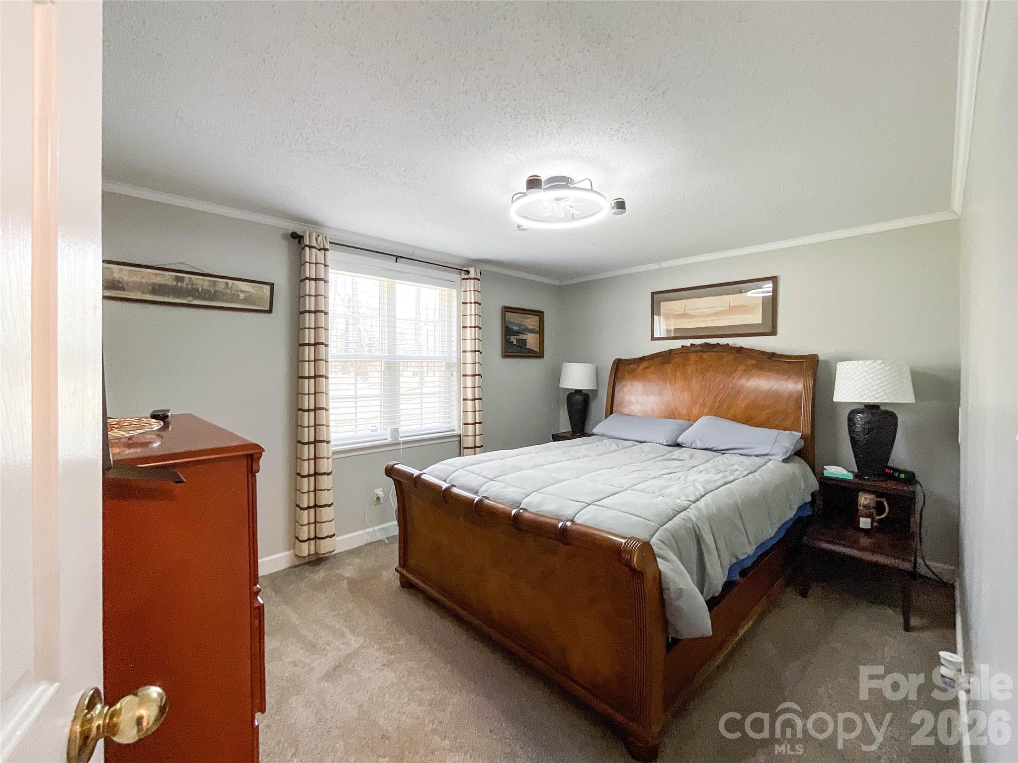 7706 Davis Road Waxhaw, NC 28173 - Photo 23 of 45 a bedroom with a bed and window