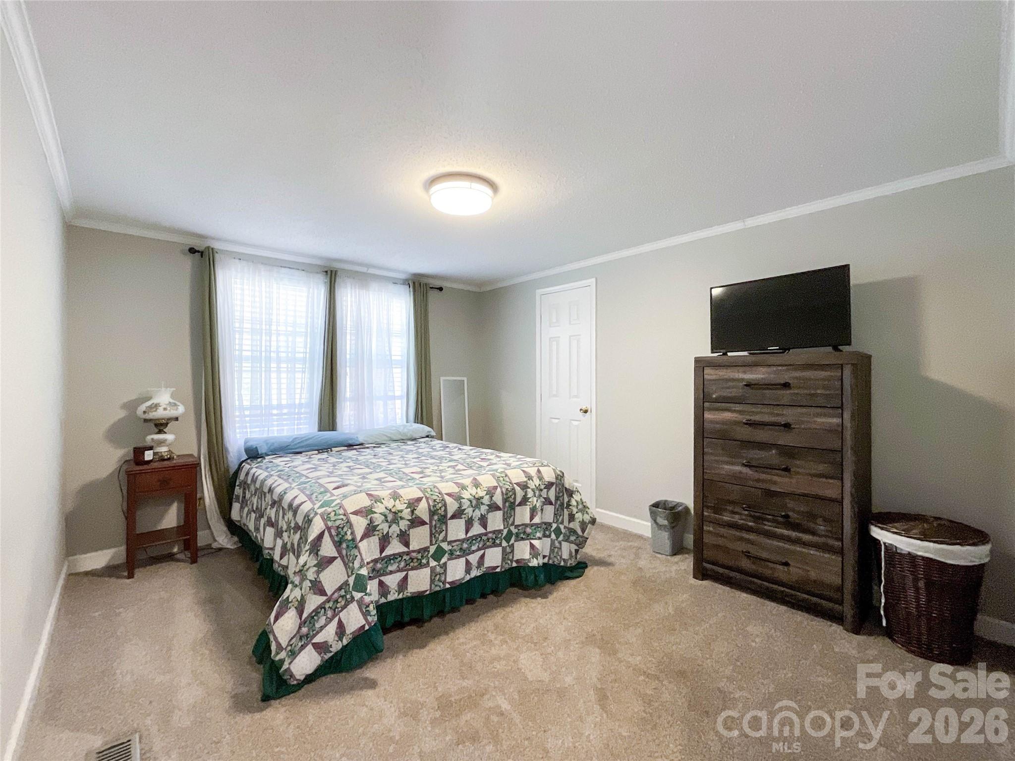 7706 Davis Road Waxhaw, NC 28173 - Photo 26 of 45 a bedroom with a bed and furniture
