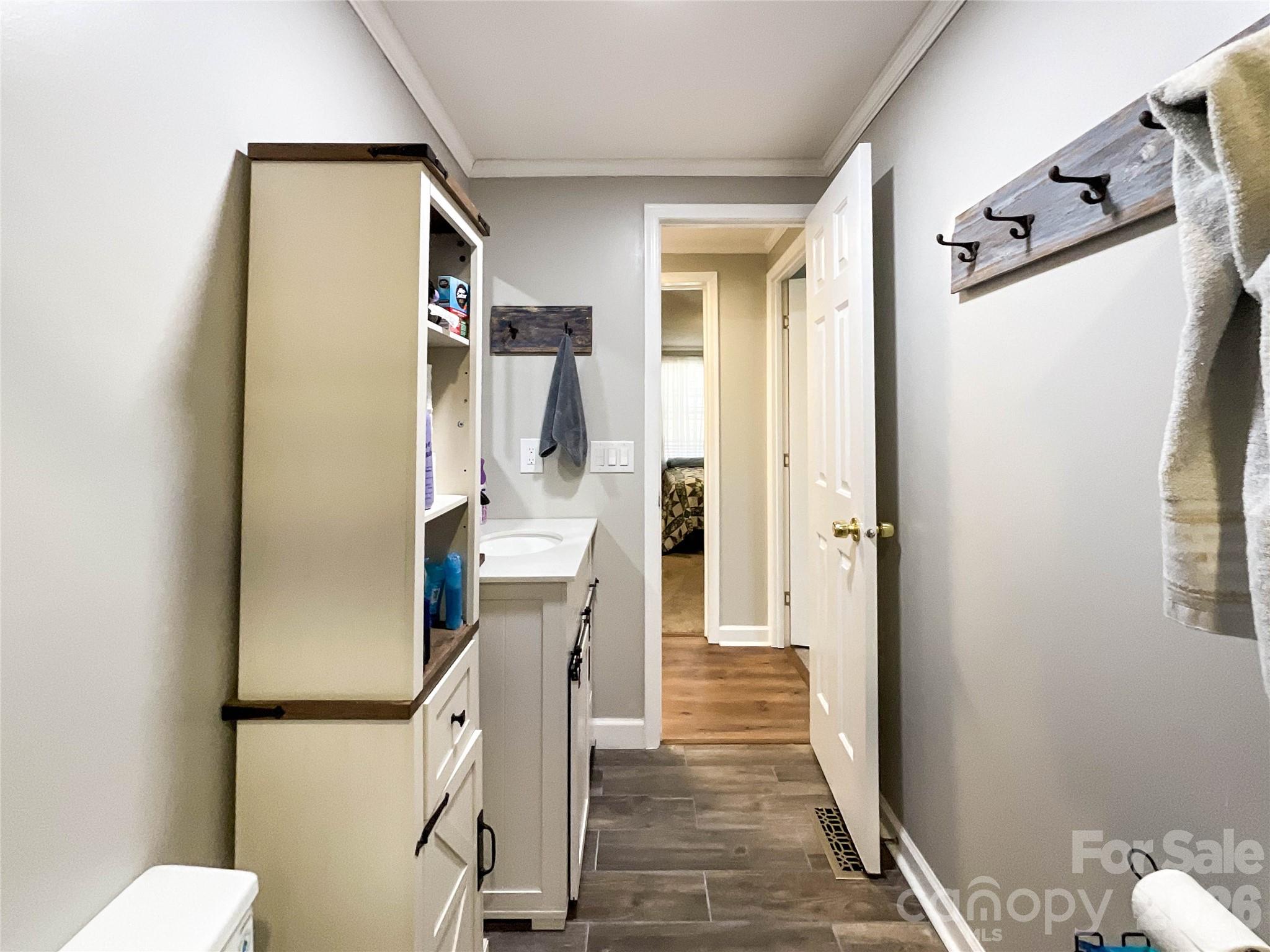 7706 Davis Road Waxhaw, NC 28173 - Photo 27 of 45 a view of a hallway with wooden floor and staircase