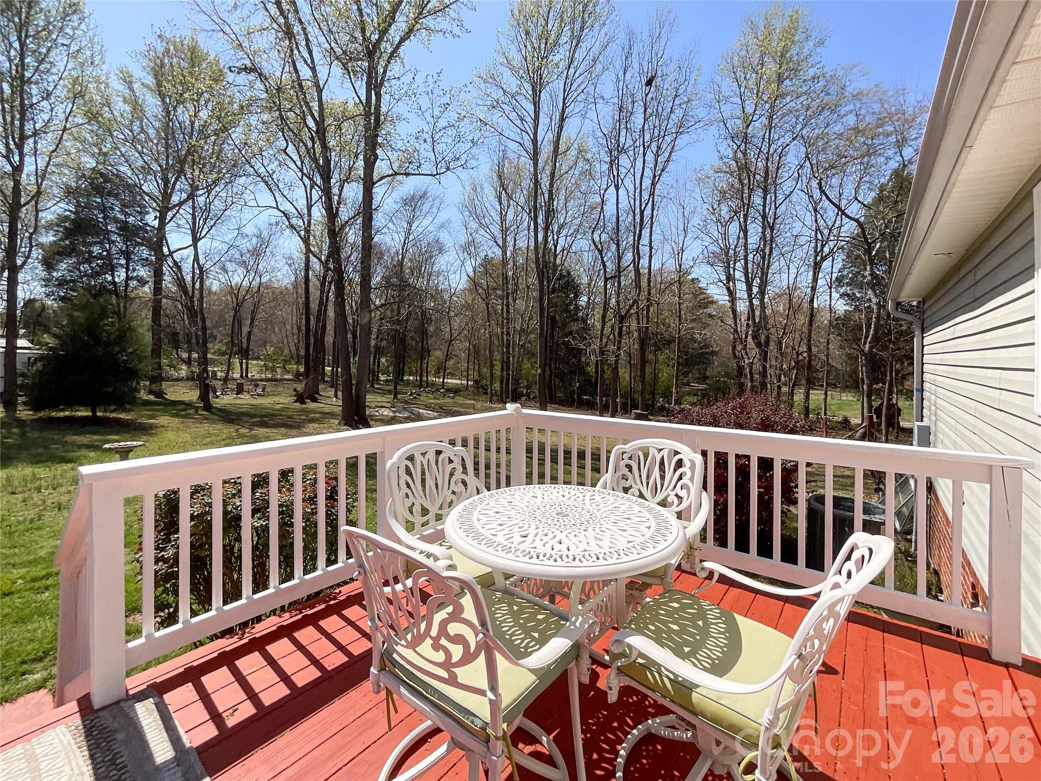 7706 Davis Road Waxhaw, NC 28173 - Photo 31 of 45 a view of a chairs and table on the deck