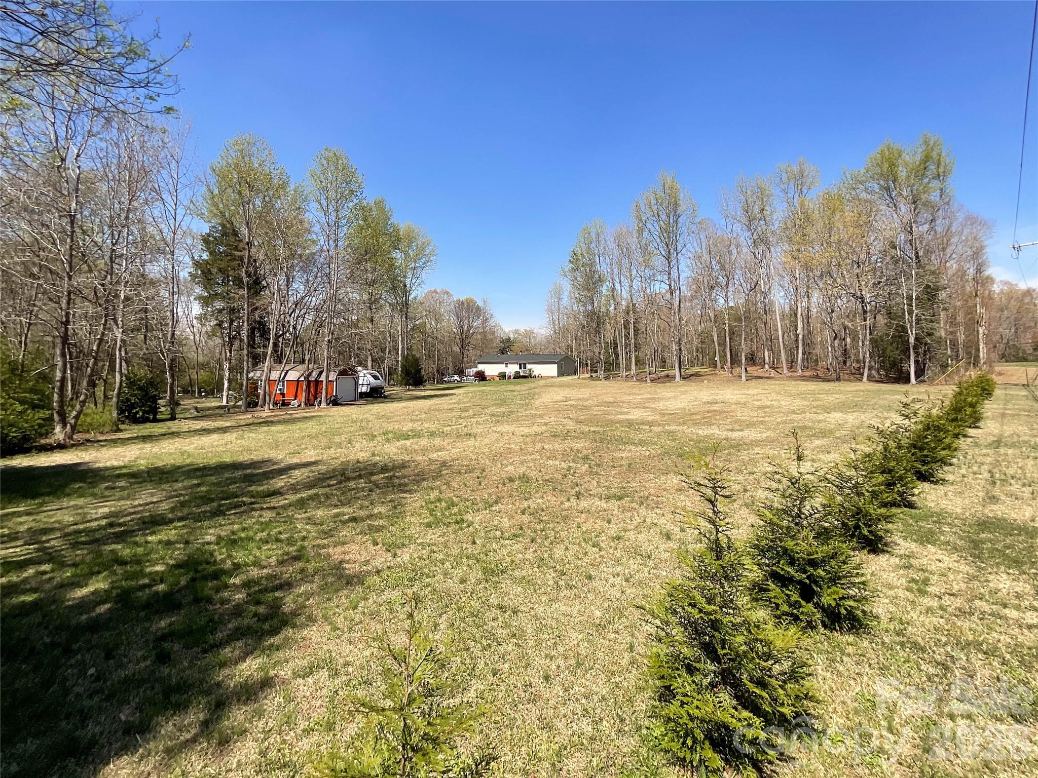 7706 Davis Road Waxhaw, NC 28173 - Photo 36 of 45 a view of road with large trees