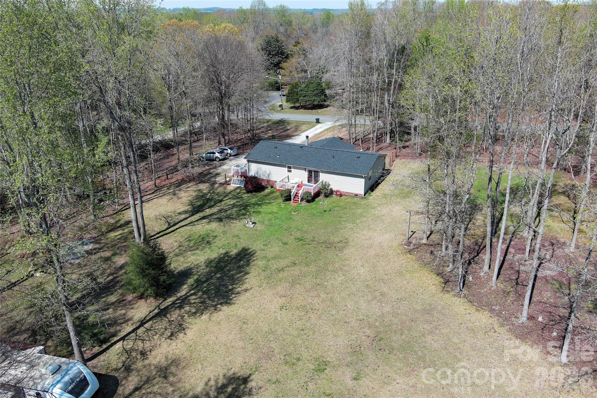 7706 Davis Road Waxhaw, NC 28173 - Photo 38 of 45 a view of a barn in the middle of a yard