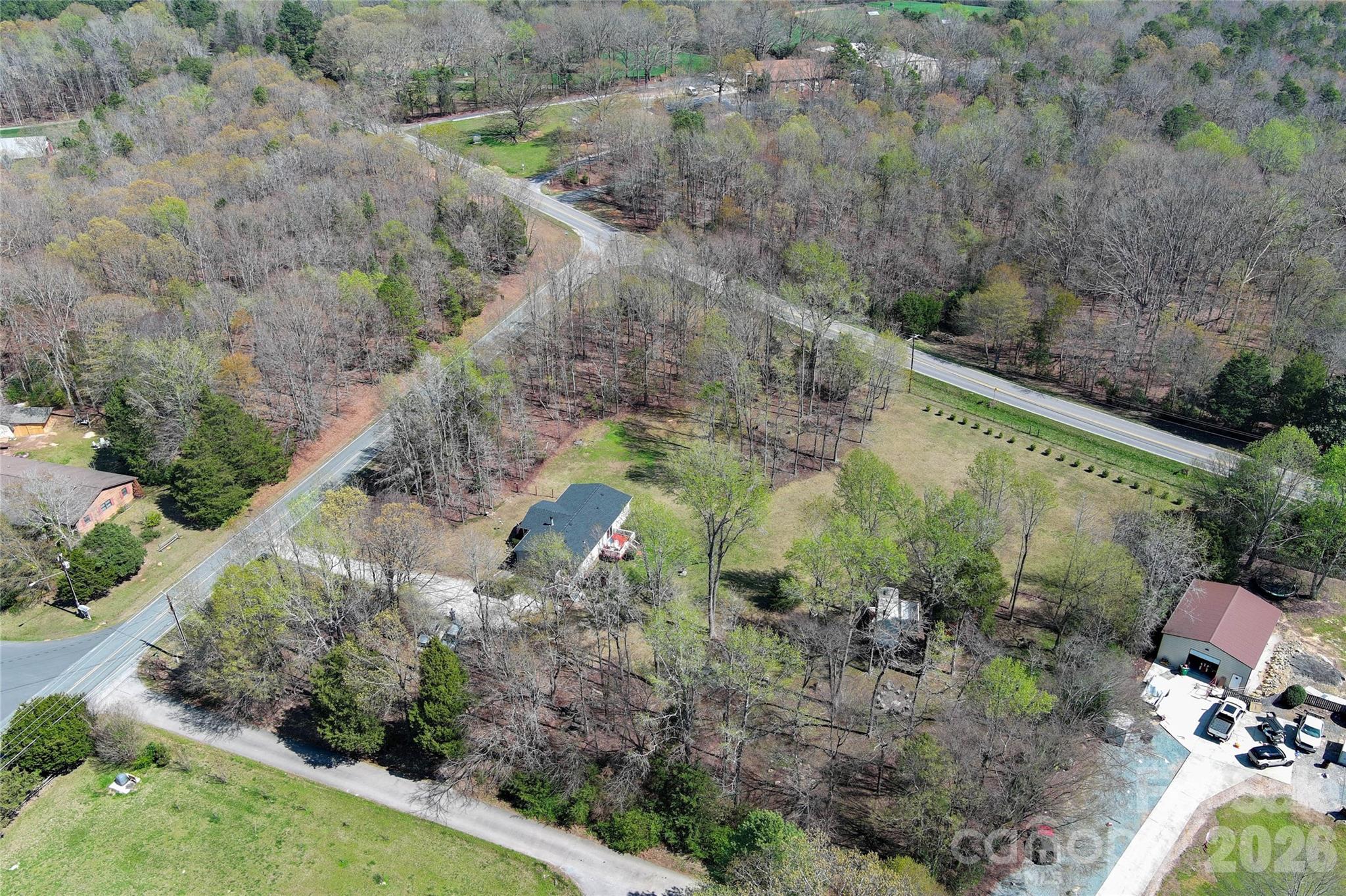 7706 Davis Road Waxhaw, NC 28173 - Photo 40 of 45 a view of a lake with large trees