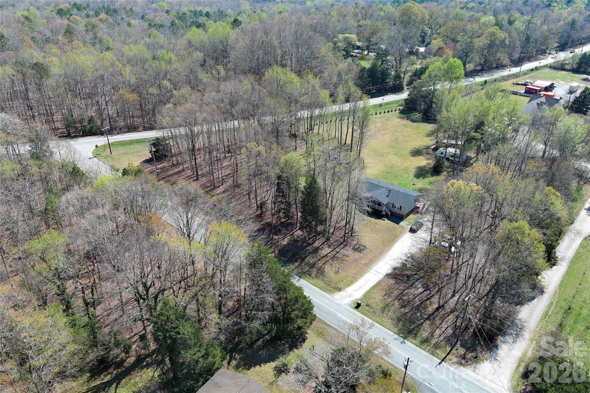 7706 Davis Road Waxhaw, NC 28173 - Photo 41 of 45 a view of a yard with large trees