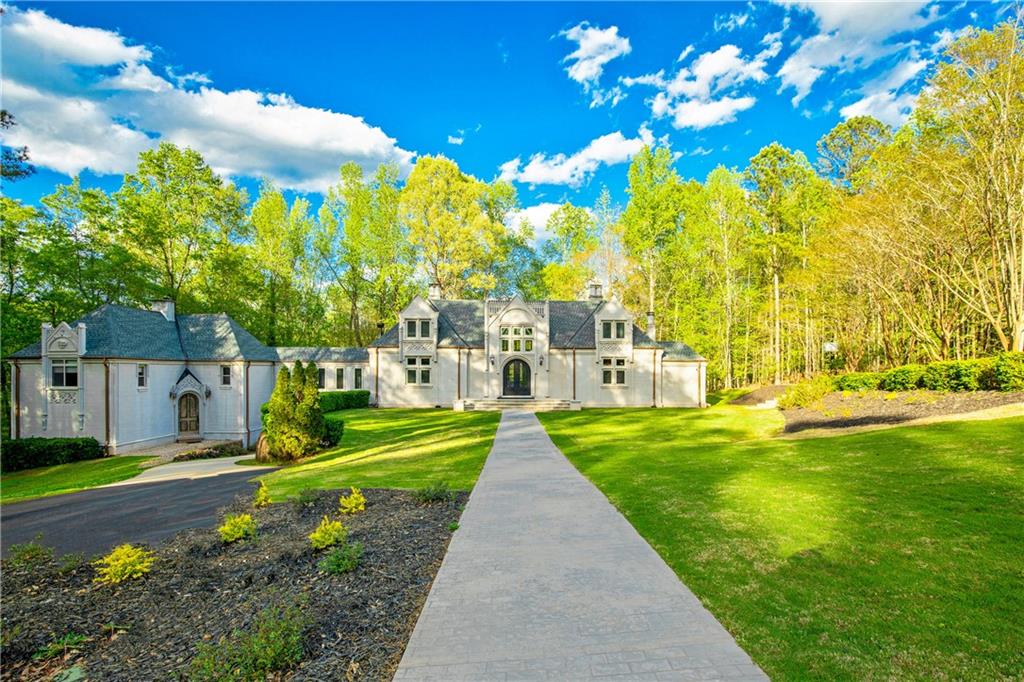 a view of yard with swimming pool and green space
