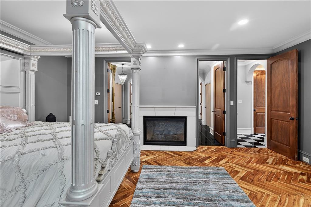 745 Goshen Road Thomaston, GA 30286 - Photo 15 of 41 a bedroom with a bed and a fireplace