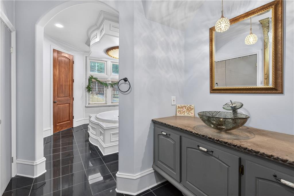 745 Goshen Road Thomaston, GA 30286 - Photo 18 of 41 a bathroom with a toilet a sink and mirror