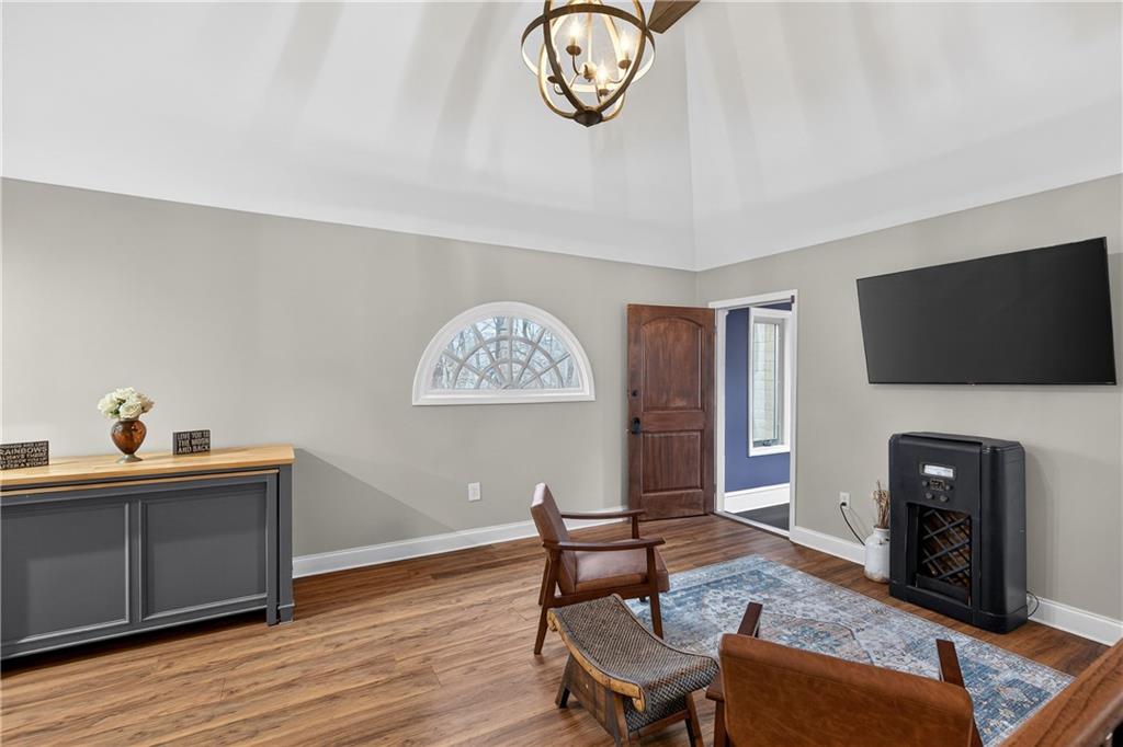 745 Goshen Road Thomaston, GA 30286 - Photo 20 of 41 a living room with furniture a flat screen tv and a window