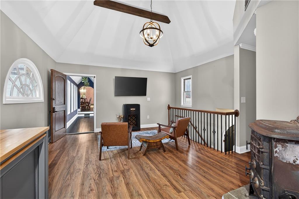 745 Goshen Road Thomaston, GA 30286 - Photo 22 of 41 a living room with furniture a fireplace and a flat screen tv