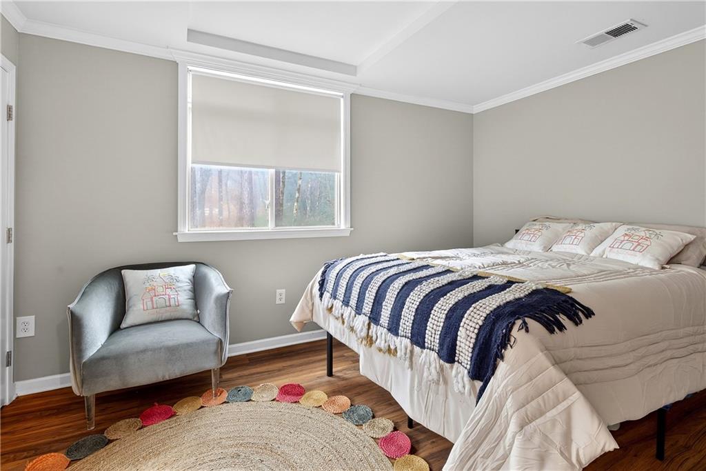 745 Goshen Road Thomaston, GA 30286 - Photo 23 of 41 a bedroom with a bed and a couch