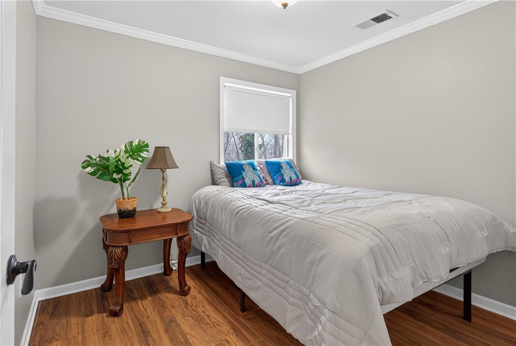 745 Goshen Road Thomaston, GA 30286 - Photo 24 of 41 a bedroom with a bed and a table in it