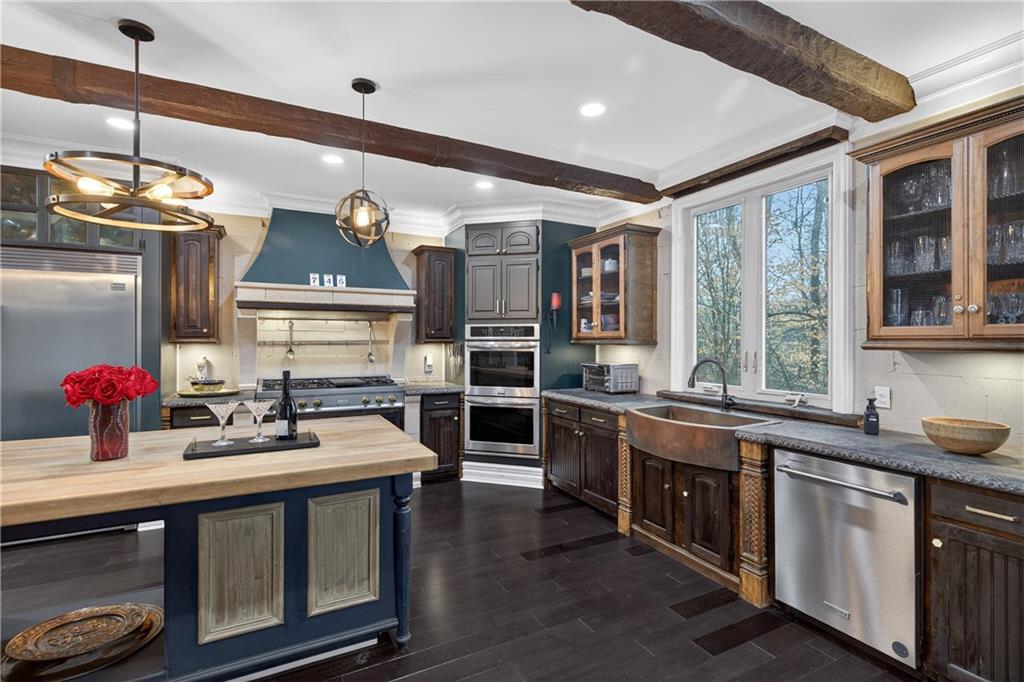 745 Goshen Road Thomaston, GA 30286 - Photo 9 of 41 a kitchen with stainless steel appliances a sink and stove