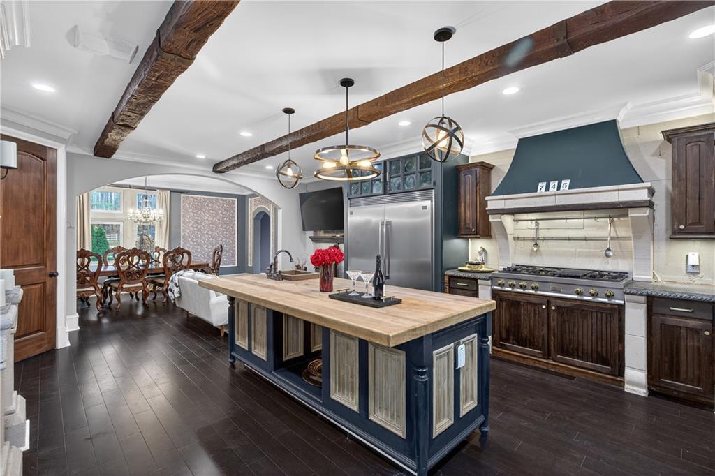 745 Goshen Road Thomaston, GA 30286 - Photo 10 of 41 a kitchen with stainless steel appliances granite countertop a stove and cabinets