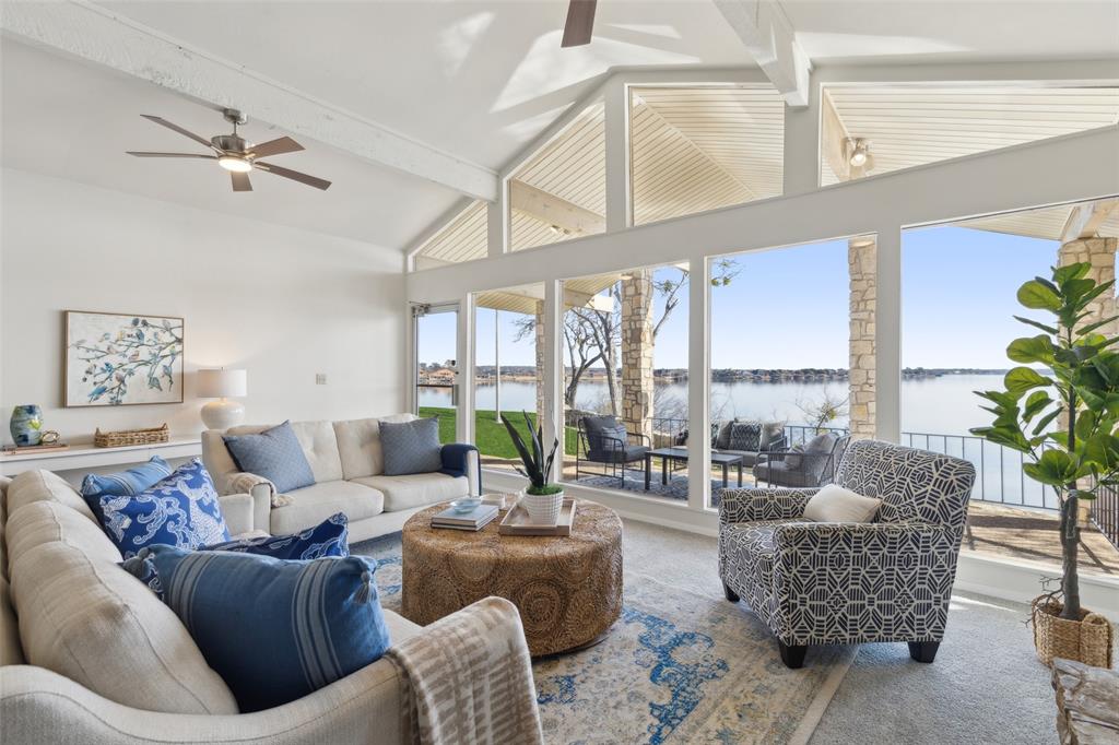648 South Rough Creek Court Granbury, TX 76048 - Photo 2 of 26 a living room with furniture and a large window