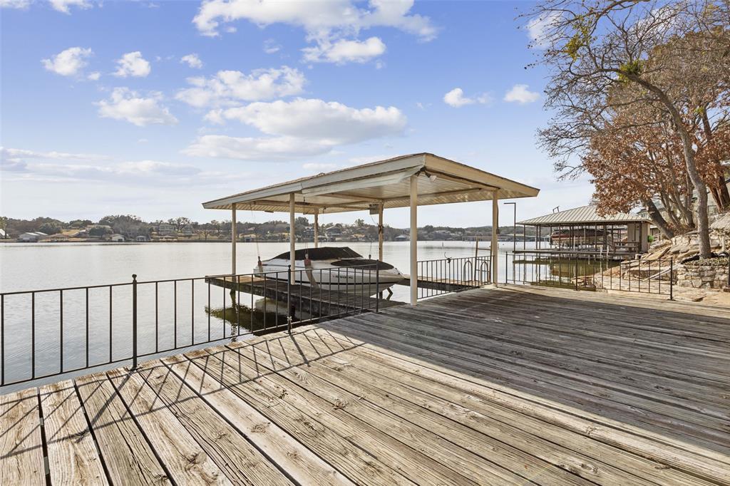 648 South Rough Creek Court Granbury, TX 76048 - Photo 8 of 26 a view of a roof with wooden floor