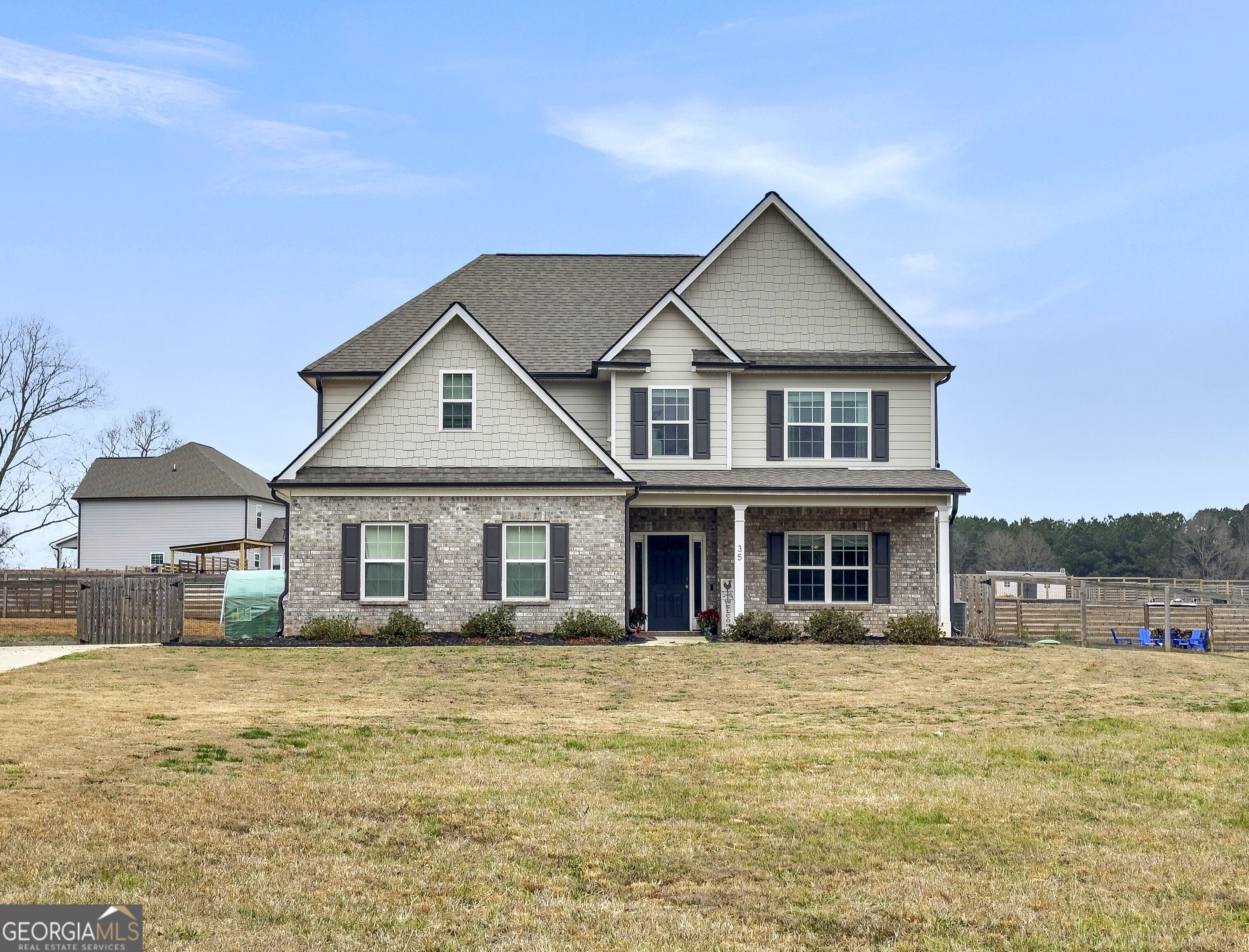35 Sandy Ridge Road McDonough, GA 30252 - Photo 12 of 63 a front view of a house with a yard