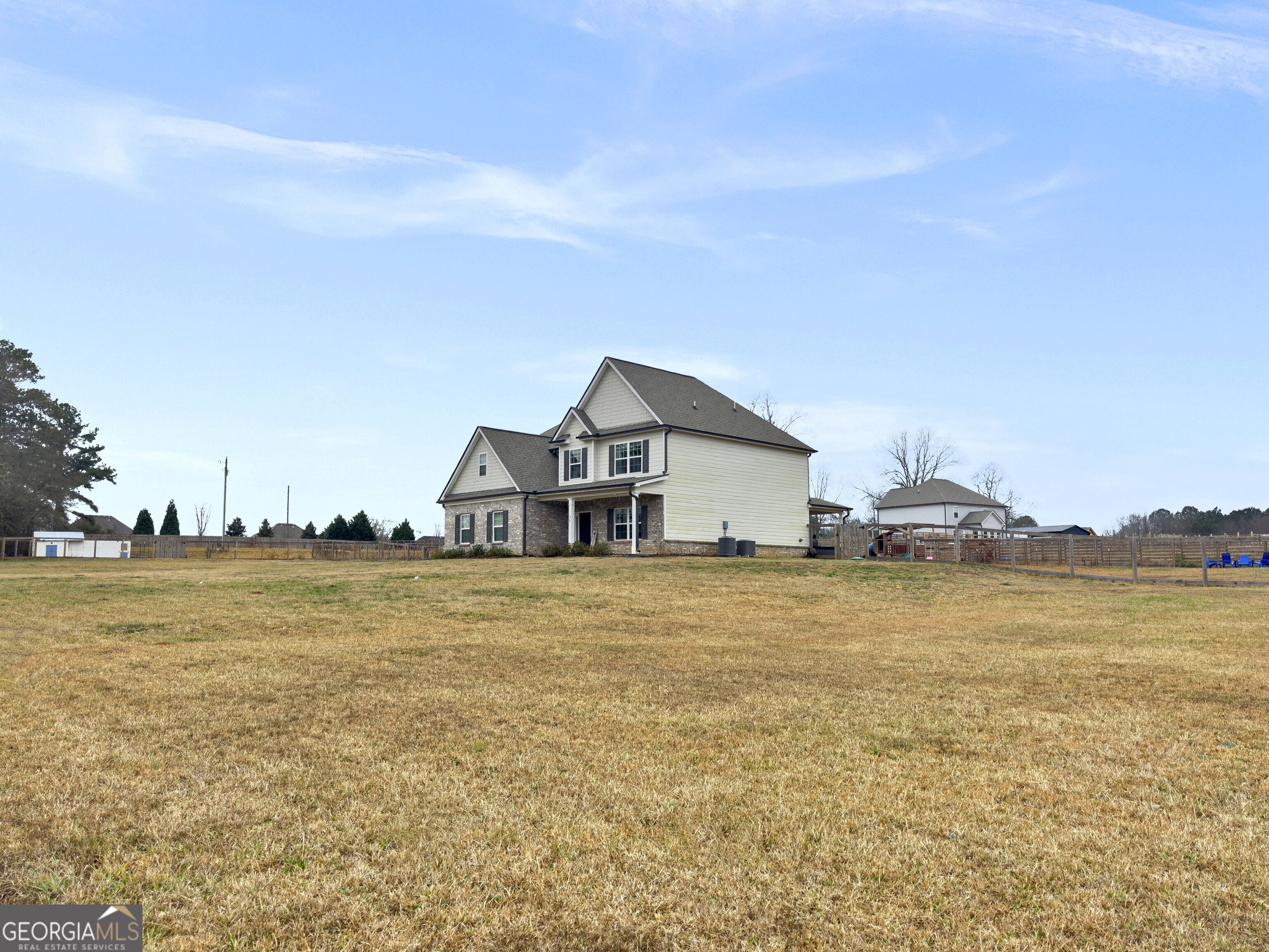 35 Sandy Ridge Road McDonough, GA 30252 - Photo 14 of 63 a house with trees in front of it