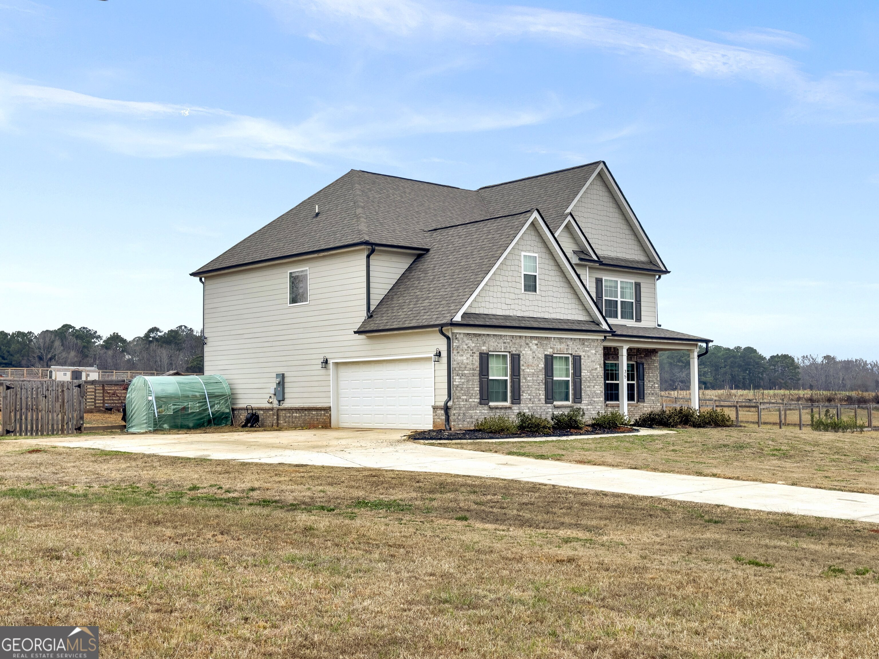35 Sandy Ridge Road McDonough, GA 30252 - Photo 16 of 63 a front view of a house with a yard