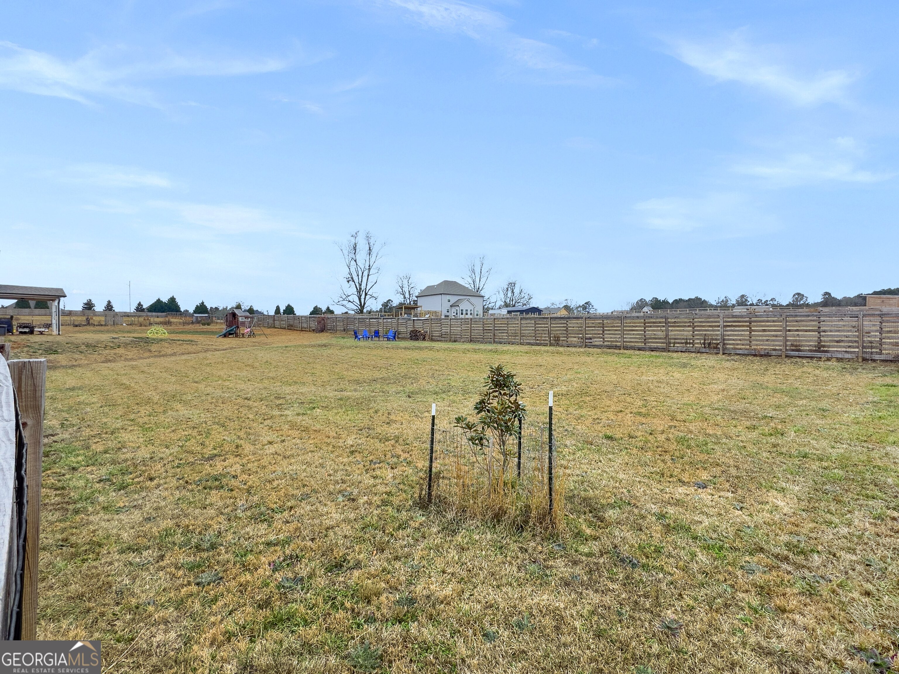 35 Sandy Ridge Road McDonough, GA 30252 - Photo 21 of 63 a view of a lake with houses in back
