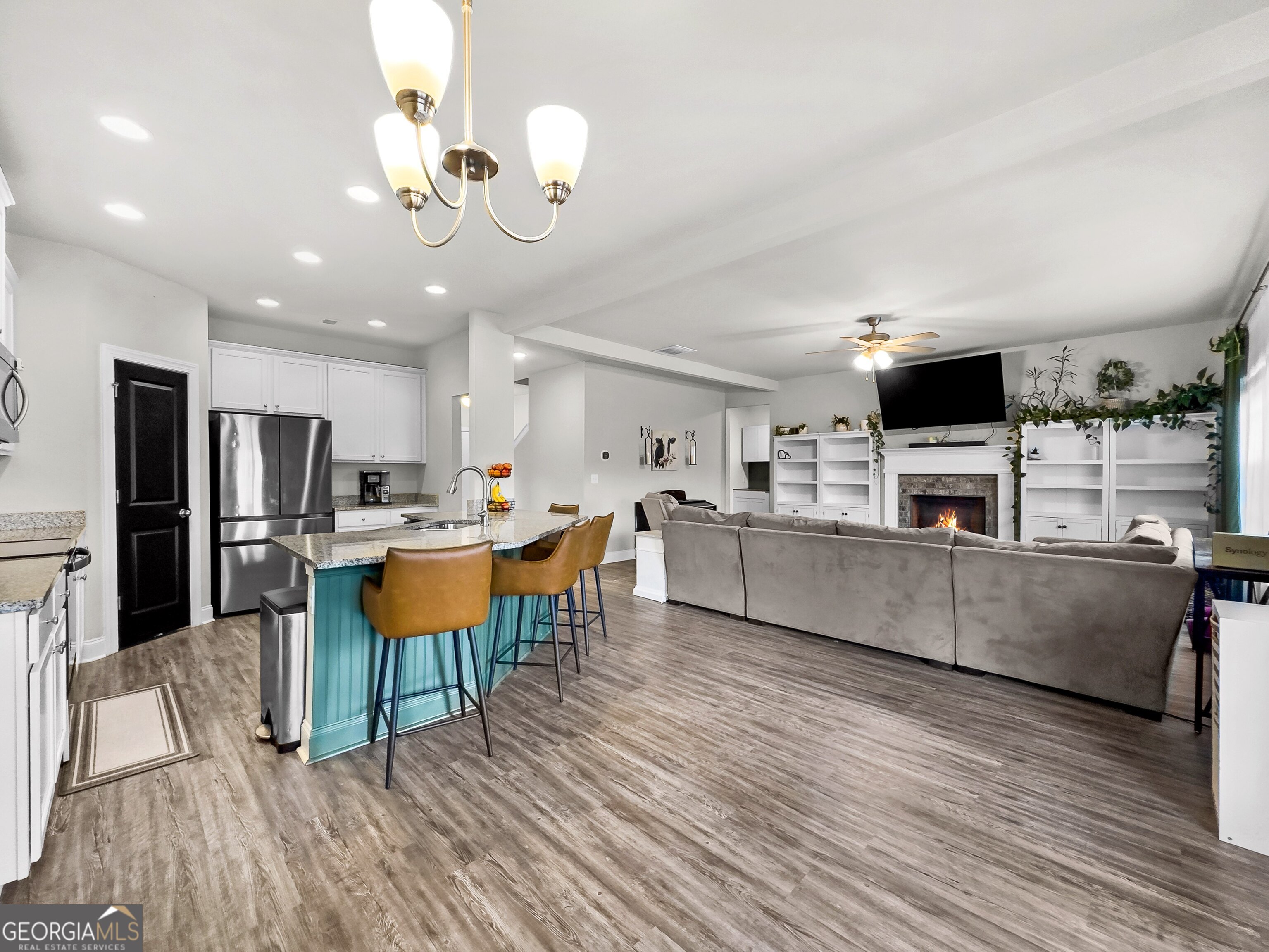 35 Sandy Ridge Road McDonough, GA 30252 - Photo 27 of 63 a living room with stainless steel appliances kitchen island granite countertop furniture a kitchen view and living room view