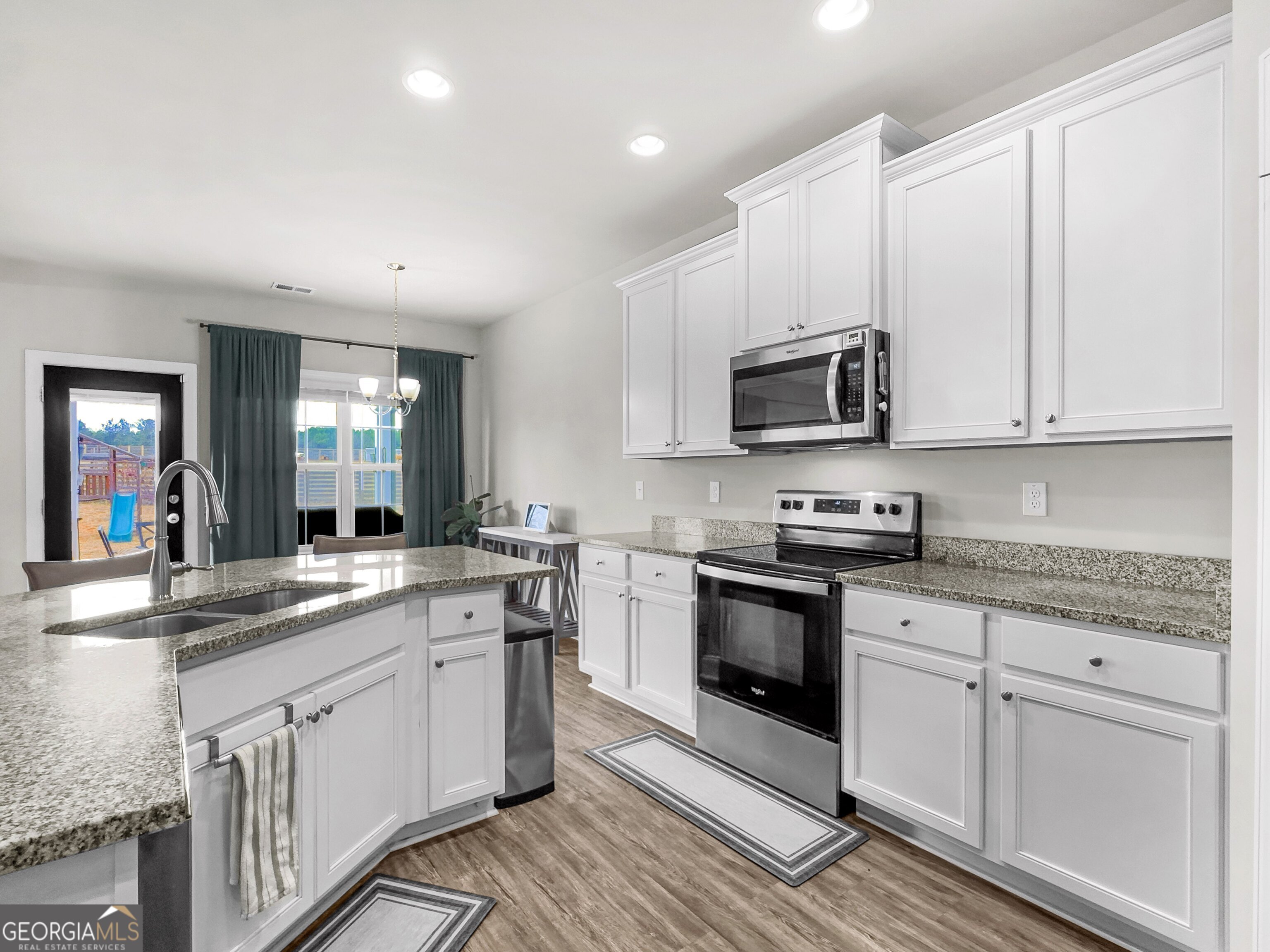 35 Sandy Ridge Road McDonough, GA 30252 - Photo 32 of 63 a kitchen with appliances cabinets and a sink