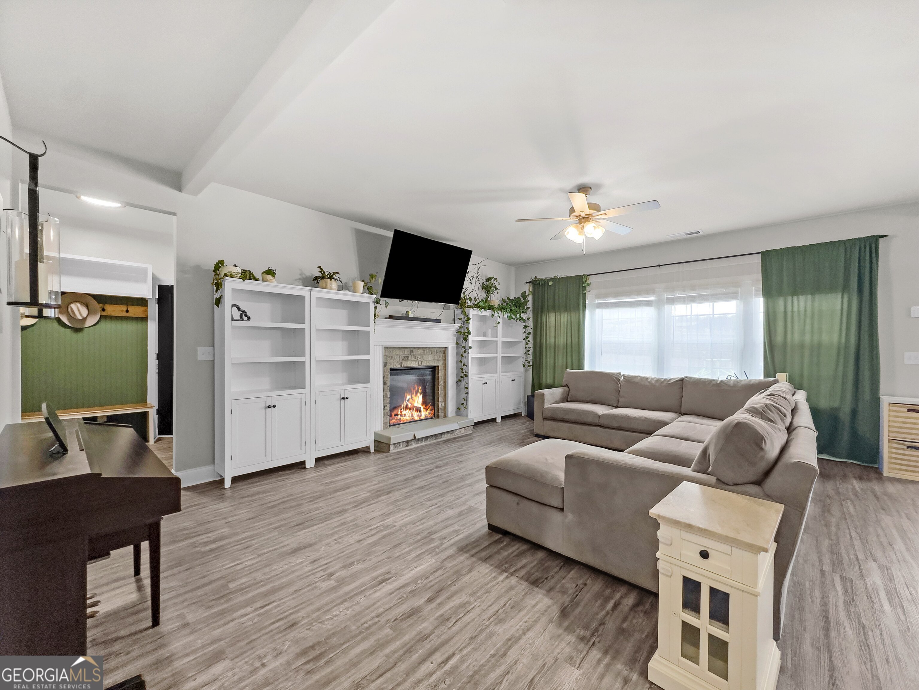 35 Sandy Ridge Road McDonough, GA 30252 - Photo 33 of 63 a living room with furniture and a fireplace