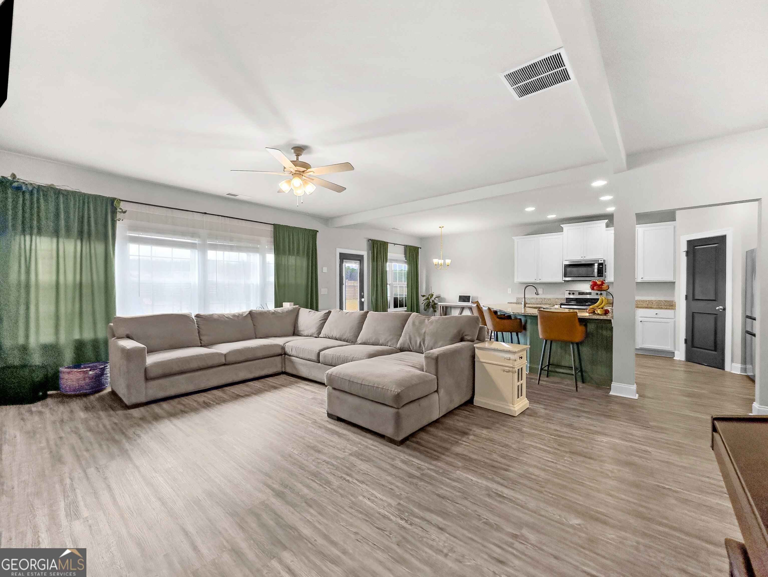 35 Sandy Ridge Road McDonough, GA 30252 - Photo 34 of 63 a living room with furniture and a wooden floor