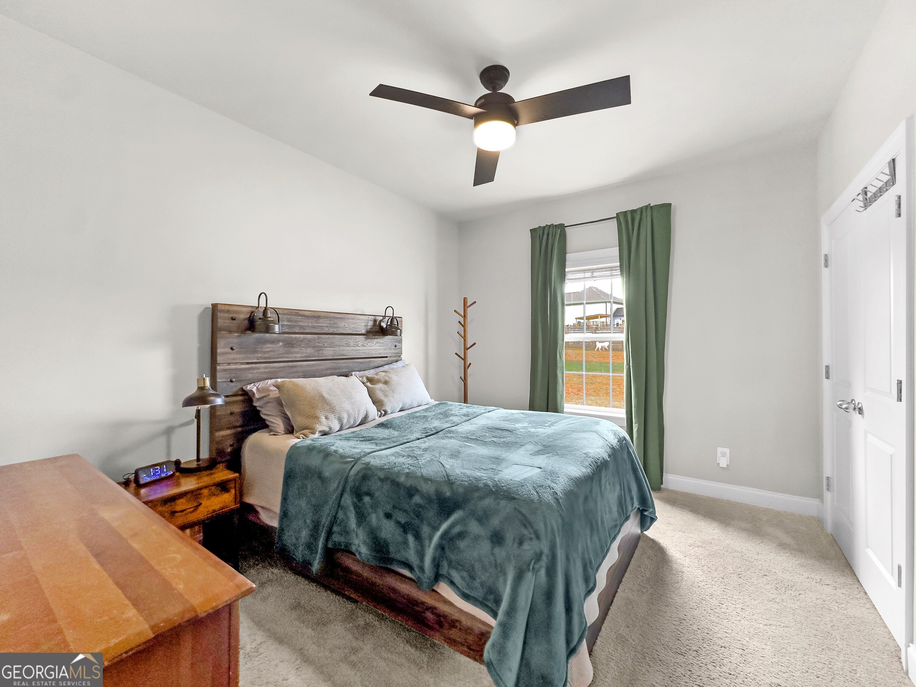 35 Sandy Ridge Road McDonough, GA 30252 - Photo 37 of 63 a bedroom with a bed and a ceiling fan