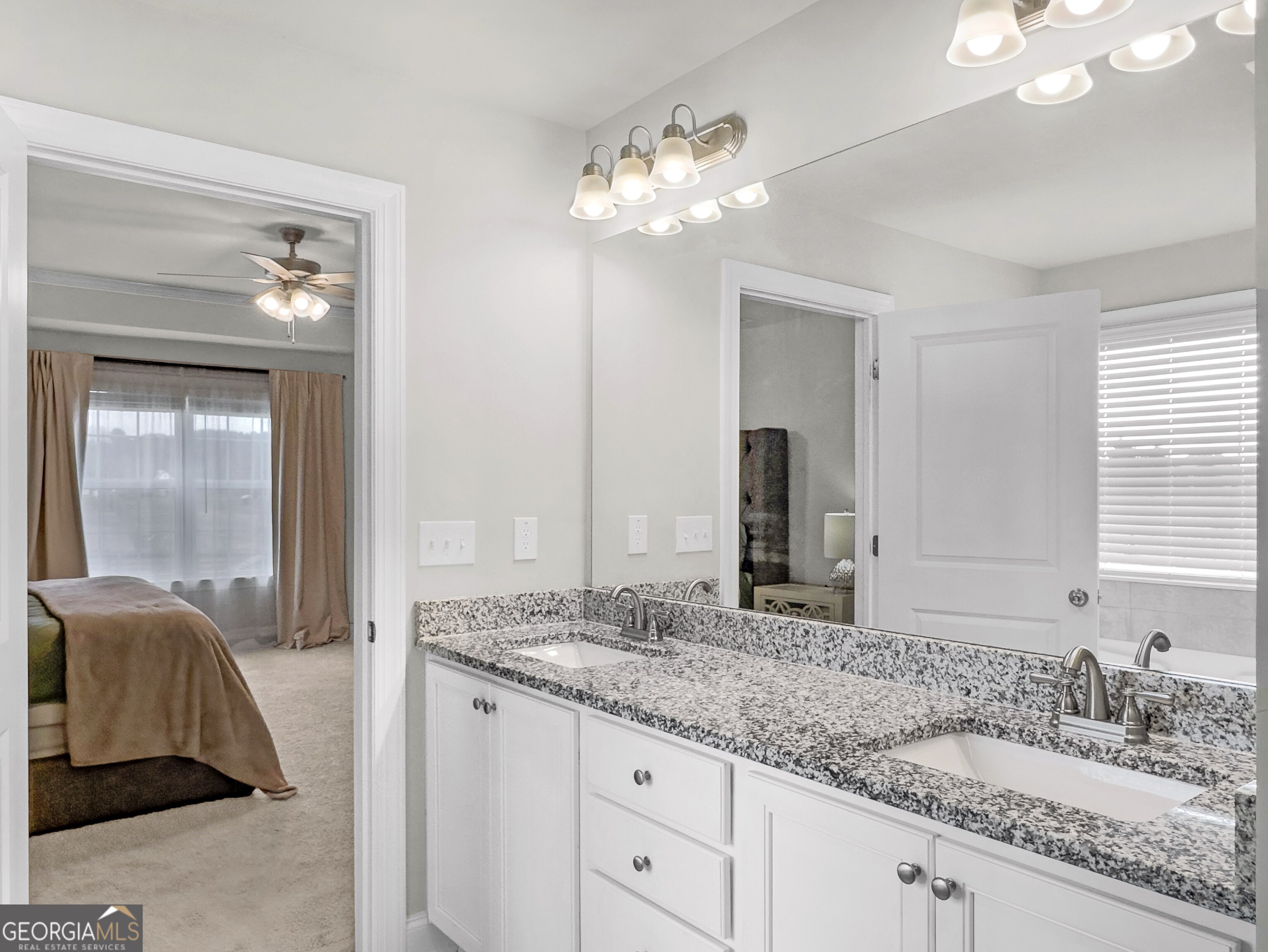 35 Sandy Ridge Road McDonough, GA 30252 - Photo 48 of 63 a bathroom with a granite countertop sink and a mirror