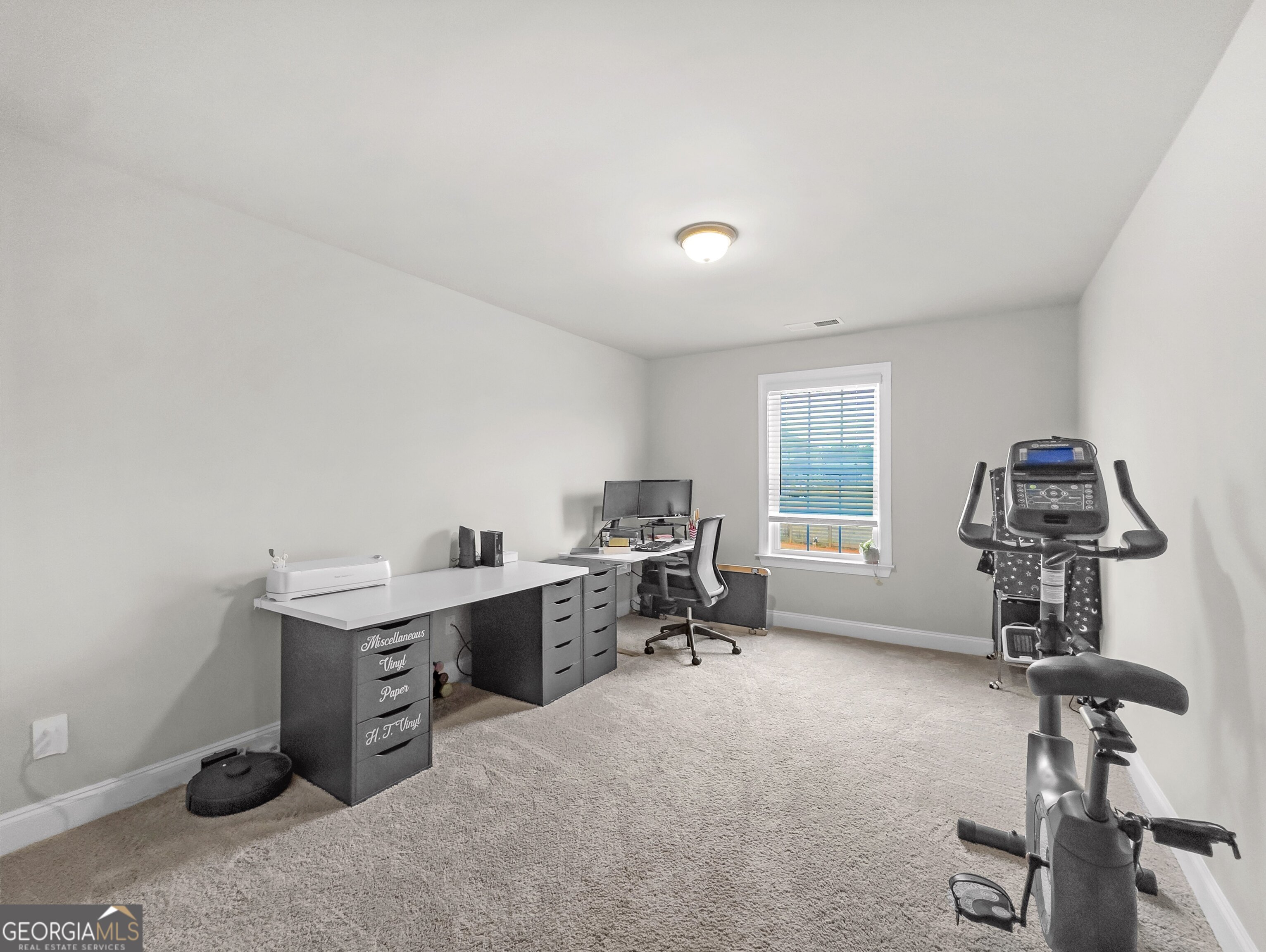 35 Sandy Ridge Road McDonough, GA 30252 - Photo 55 of 63 a view of a workspace with furniture and a window