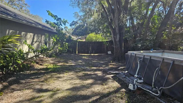 a view of a backyard with pathway