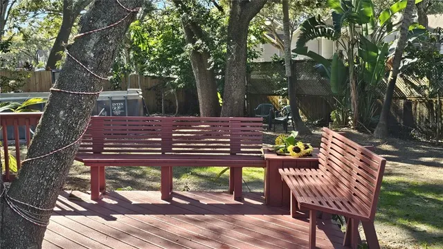 a view of a chairs and table in the patio