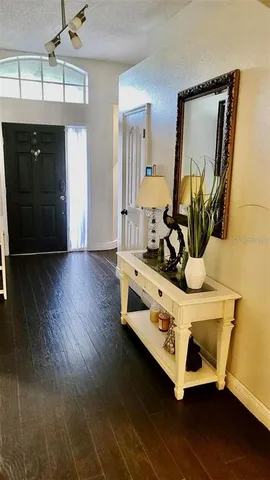 a view of living room with wooden floor