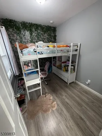 a view of a chairs and table on the roof deck