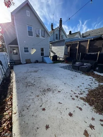 a view of a house with a backyard