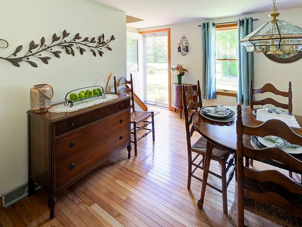 281 South Sandwich Road Mashpee, MA 02649 - Photo 11 of 25 a dining room with furniture a window and wooden floor