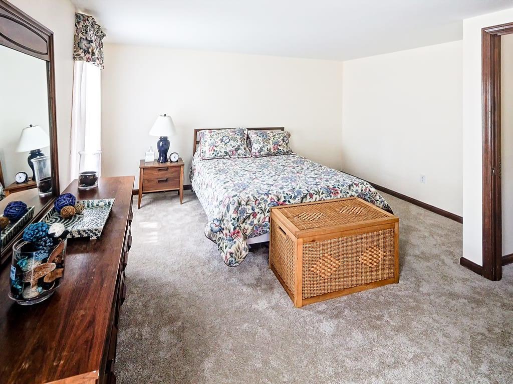 281 South Sandwich Road Mashpee, MA 02649 - Photo 15 of 25 a bedroom with furniture and a wooden floor