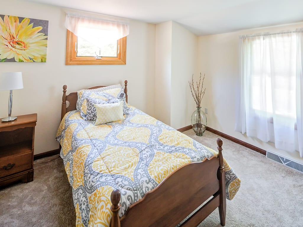 281 South Sandwich Road Mashpee, MA 02649 - Photo 17 of 25 a bed sitting in a bedroom next to a window