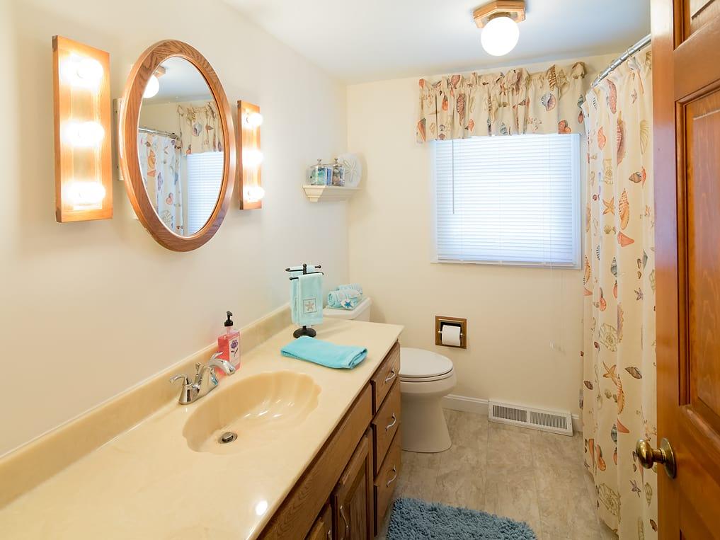 281 South Sandwich Road Mashpee, MA 02649 - Photo 19 of 25 a bathroom with a sink and a mirror
