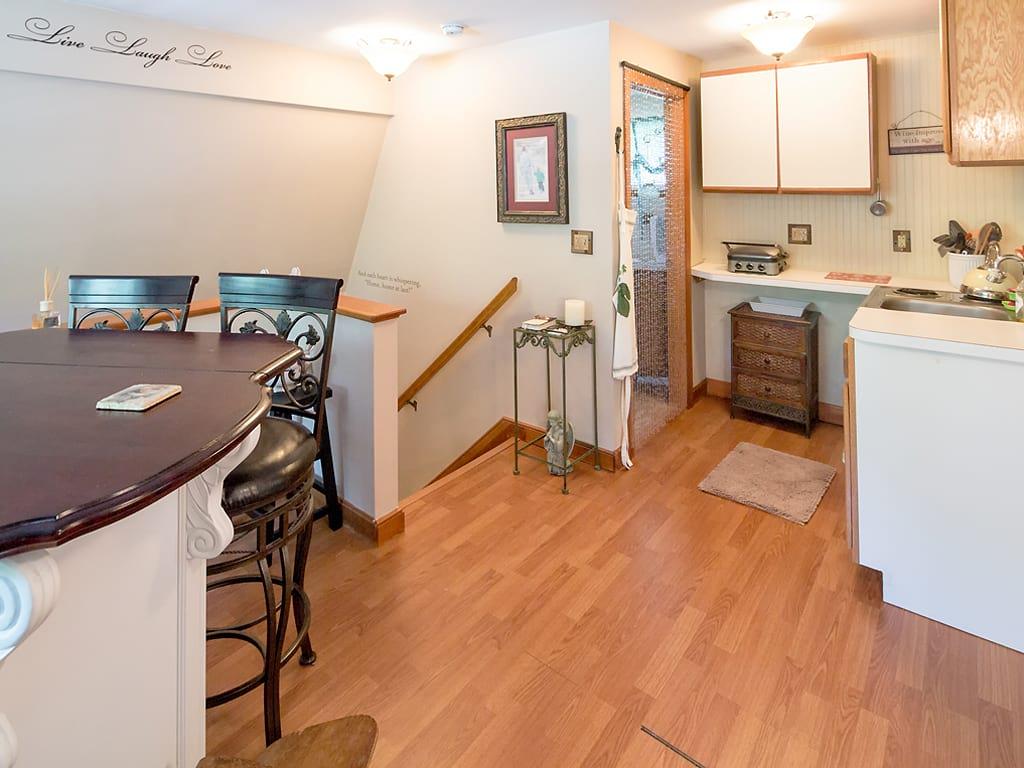 281 South Sandwich Road Mashpee, MA 02649 - Photo 20 of 25 a view of a kitchen with a sink cabinets and wooden floor