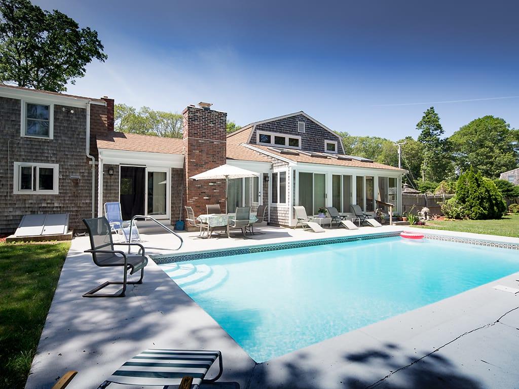 281 South Sandwich Road Mashpee, MA 02649 - Photo 2 of 25 a view of a house with swimming pool and sitting area