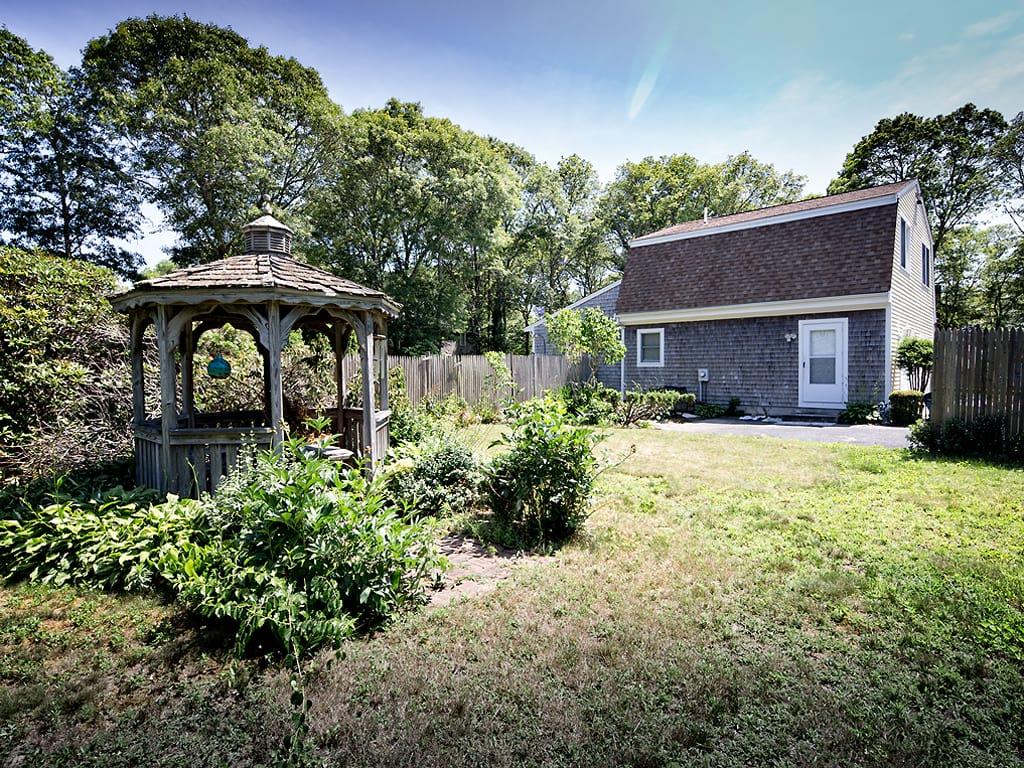 281 South Sandwich Road Mashpee, MA 02649 - Photo 23 of 25 a front view of a house with yard and green space