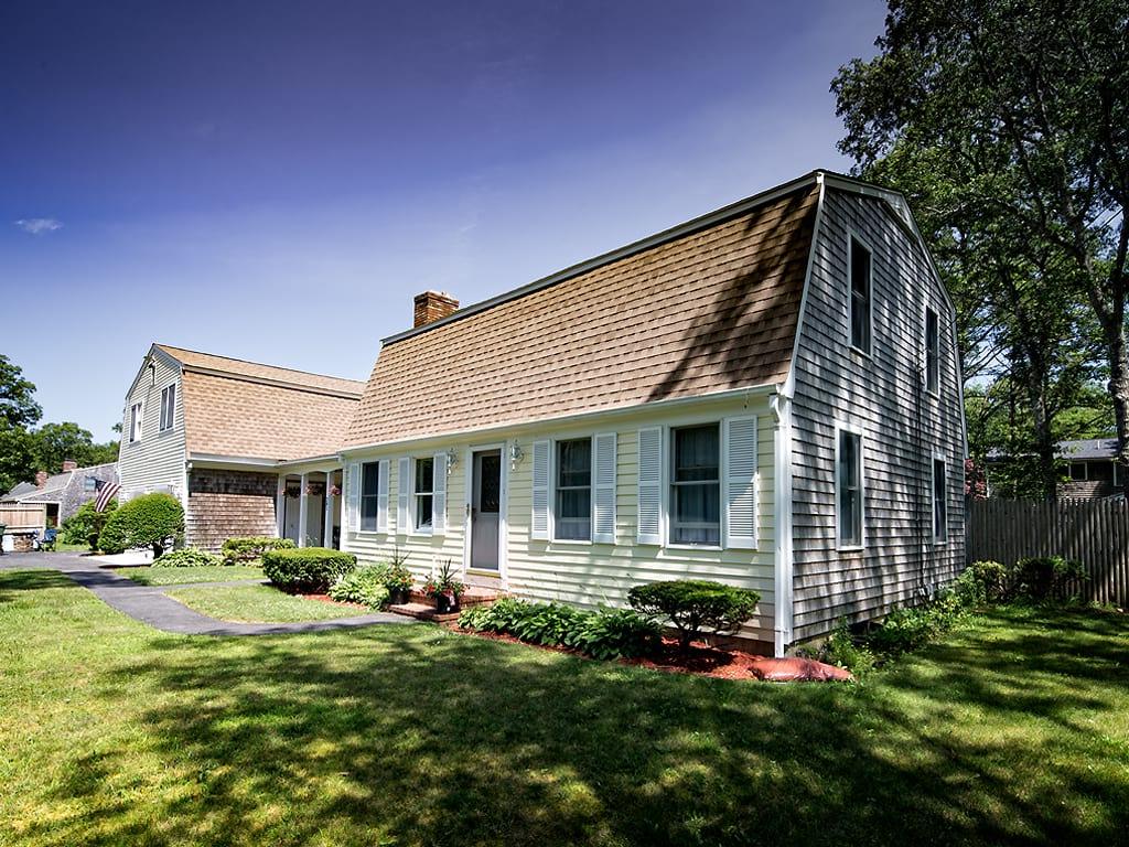 281 South Sandwich Road Mashpee, MA 02649 - Photo 3 of 25 a front view of a house with a yard