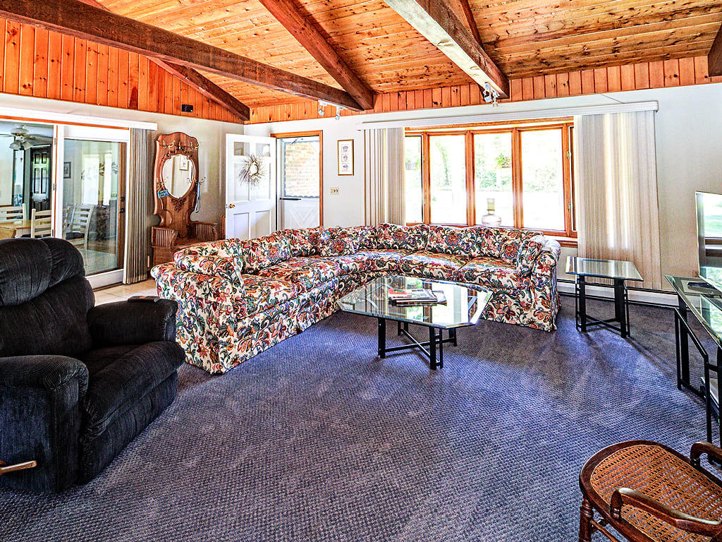 281 South Sandwich Road Mashpee, MA 02649 - Photo 4 of 25 a living room with furniture and a large window